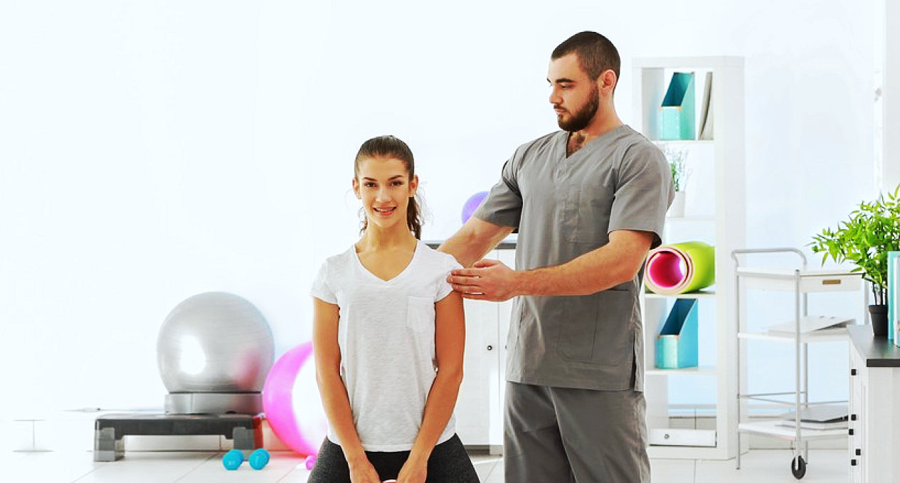 Therapist instructing a patient through an exercise