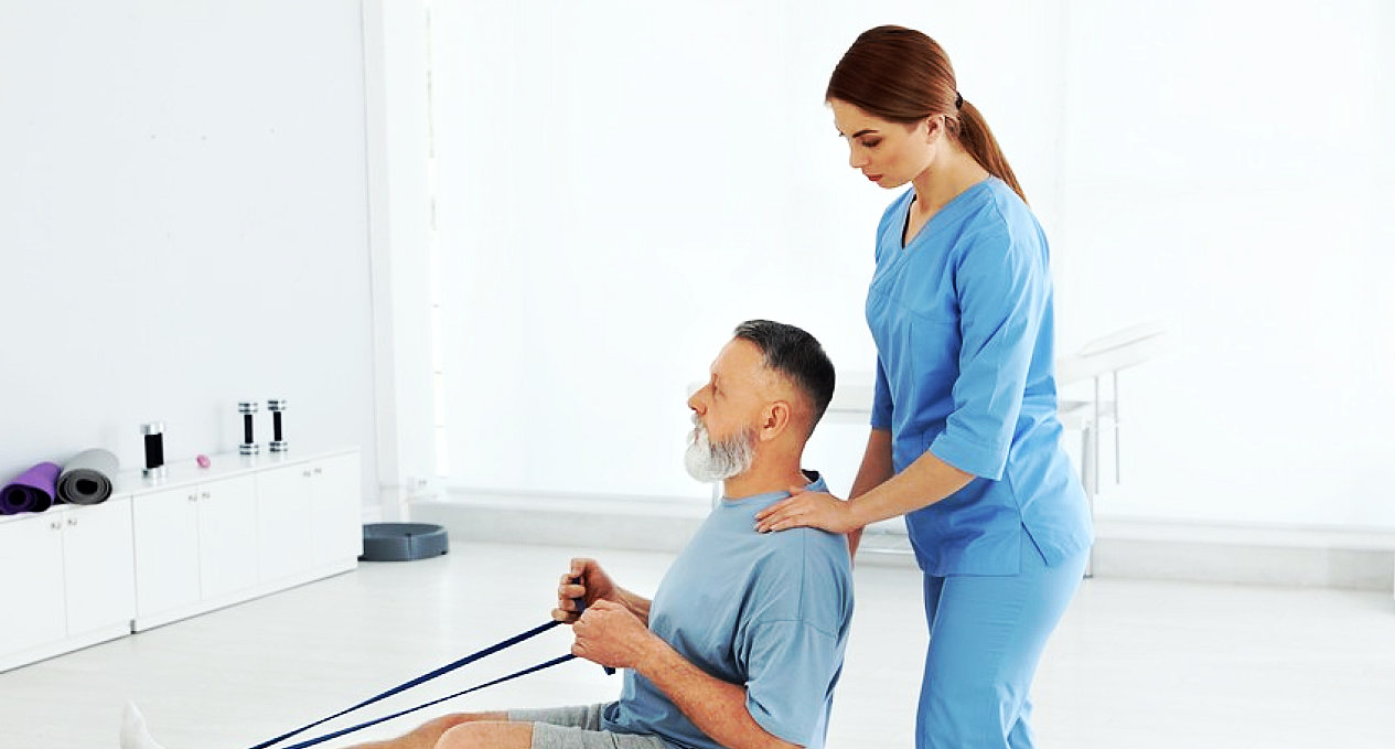 Therapist assisting an older patient with balance