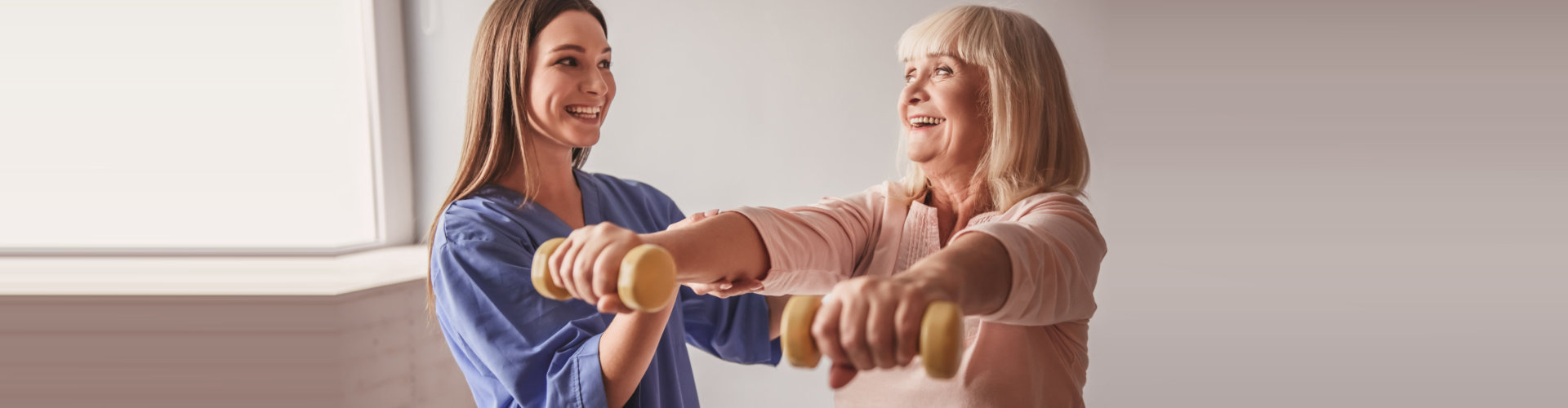 Therapist assisting an older patient